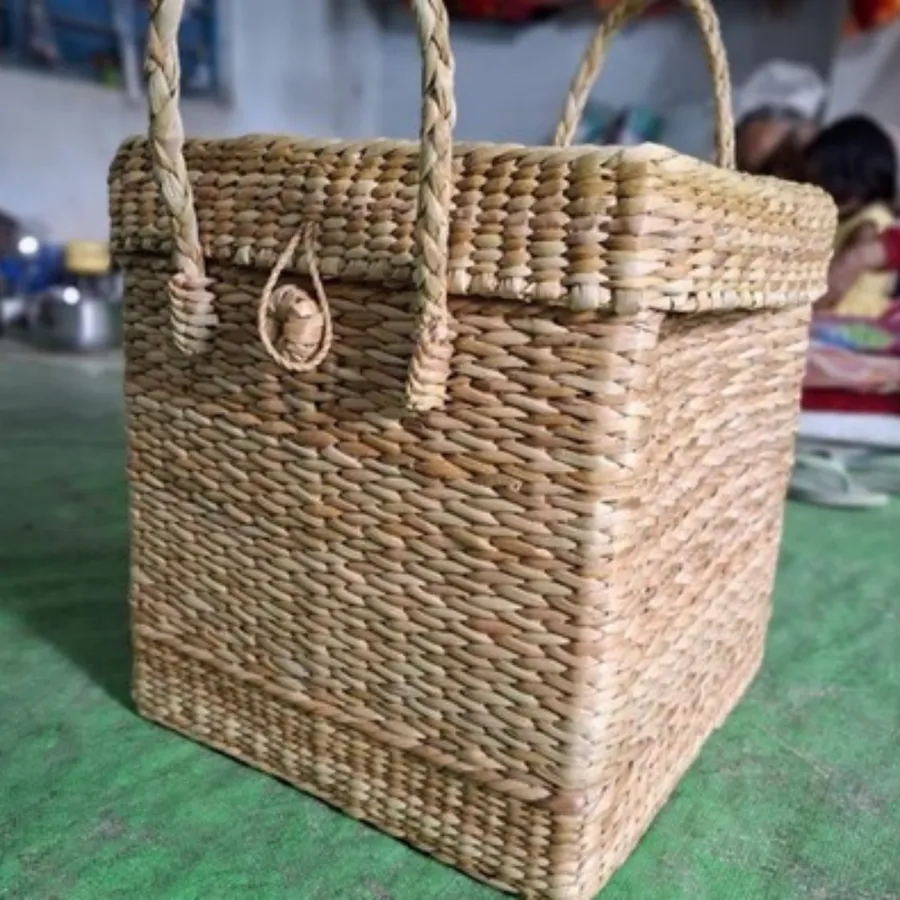 A woven basket with a lid and handle