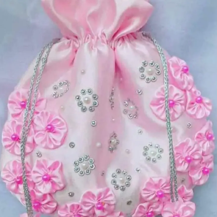 A pink embellished drawstring potli bag